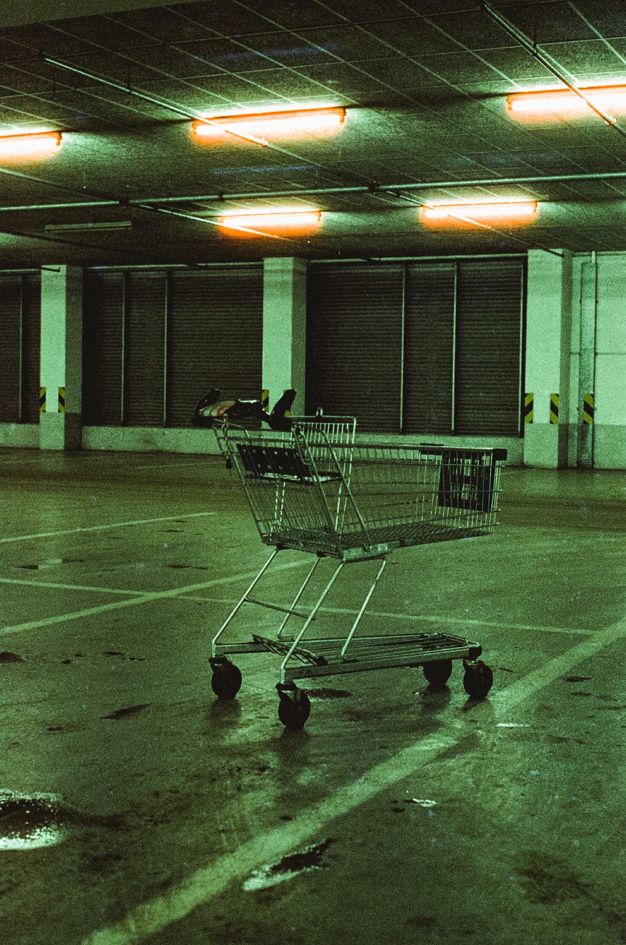 Lone shopping cart in an underground garage