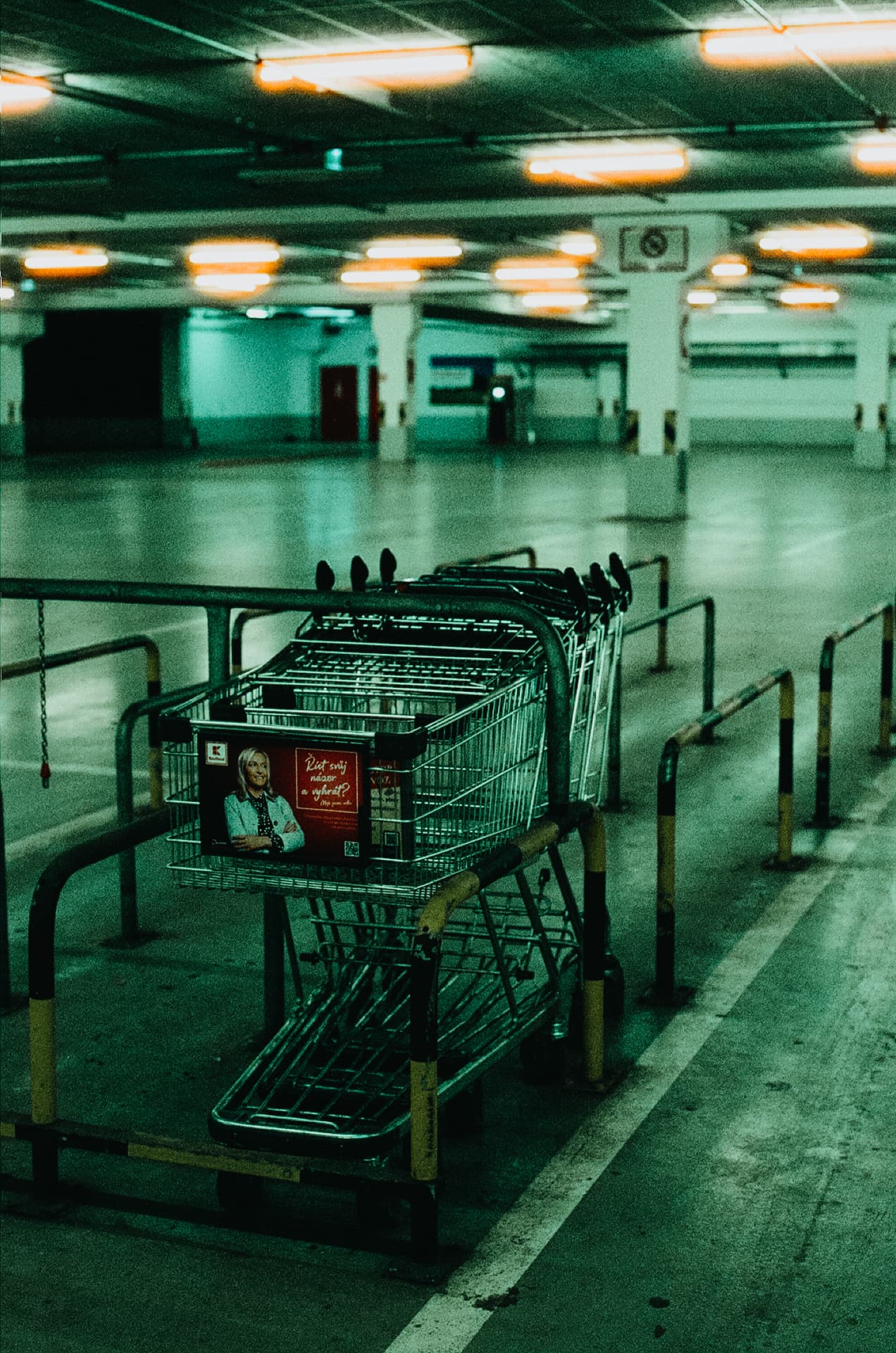 Shopping carts in a fluorescent underground garage