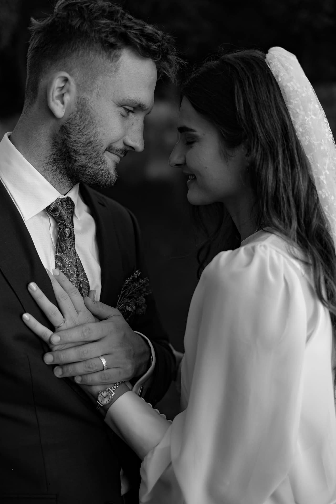 Newlyweds embracing in the rain