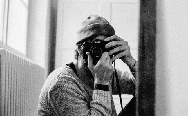Petr Kureš holding a camera